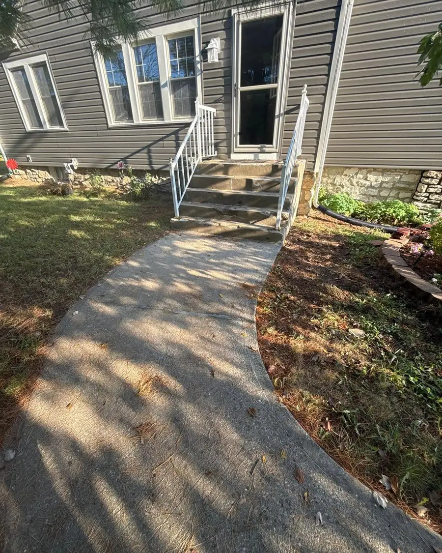 Old narrow front steps before the repair