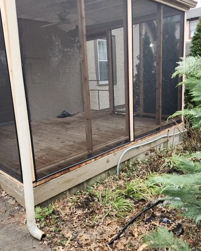 Worn screened porch floor before resurfacing