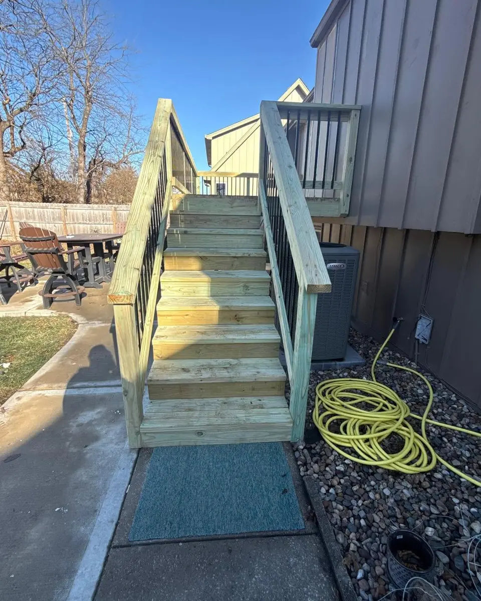 New wood deck stairs with railings built by KC Deck Services