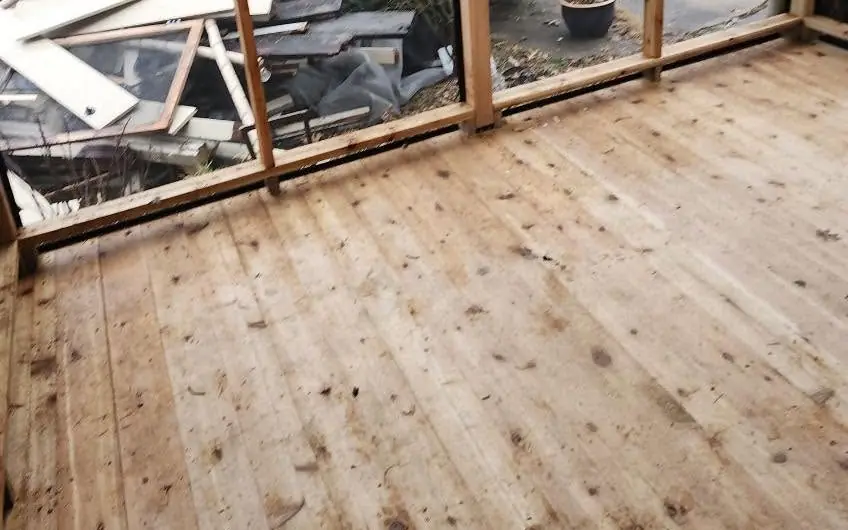 New cedar deck boards in a resurfaced Kansas City porch