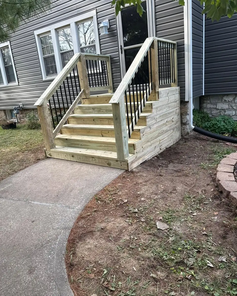 Rebuilt front steps with black railings